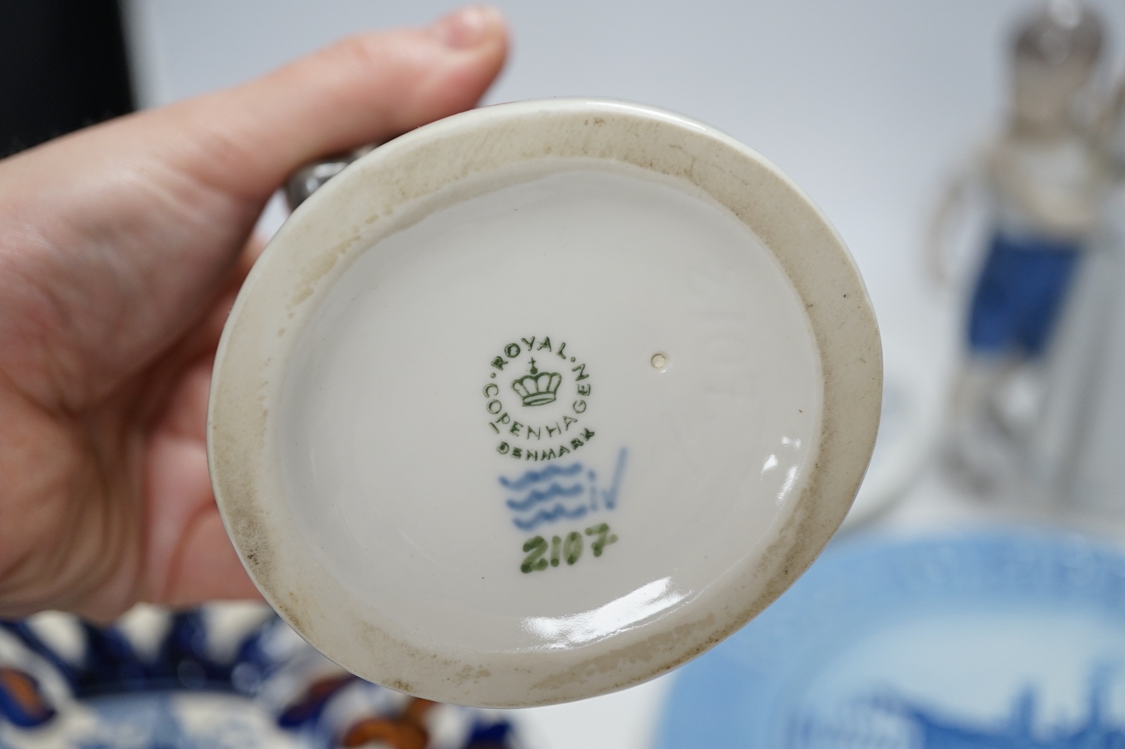 Three Royal Copenhagen and Bing and Grondahl commemorative plates and two figure groups, largest Carlsberg commemorative advertising plate 25.5cm high